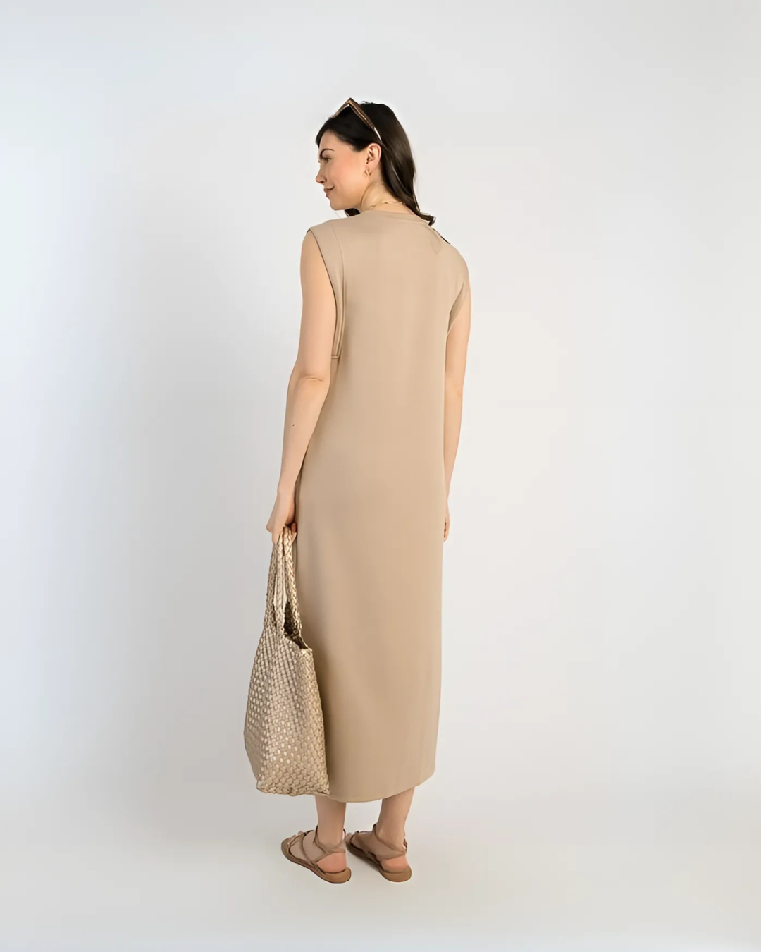 Vestido largo e ajustado com bolsos laterais 